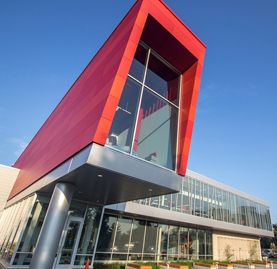 Holland Energy Park entrance: a modern gray and red building with many windows