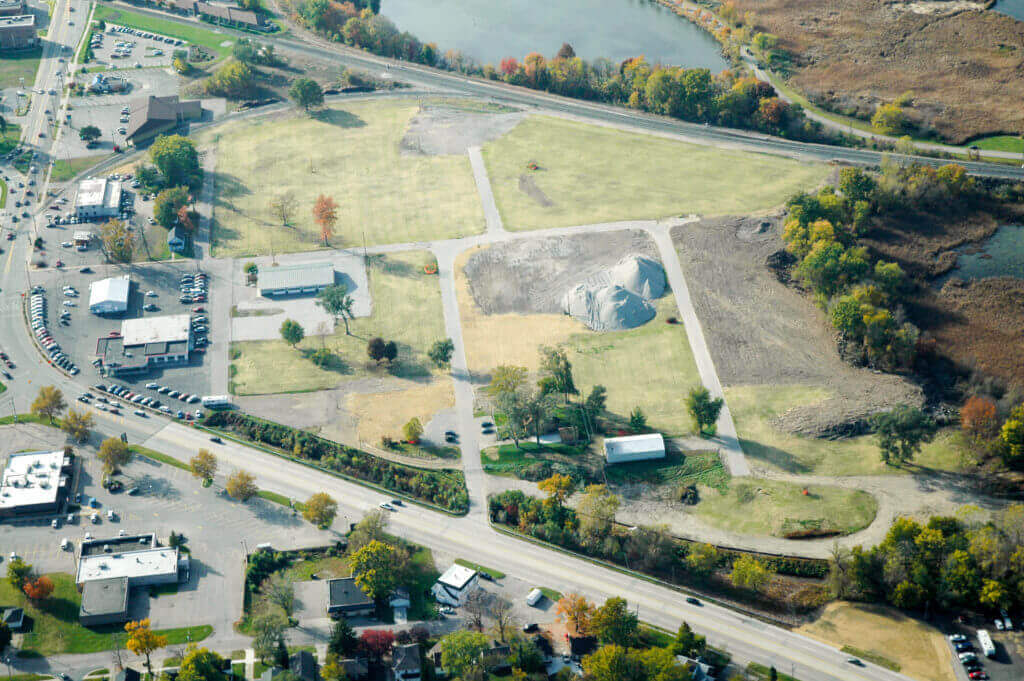 Satellite image of former First street with open fields after environmental clean up and building demolition.
