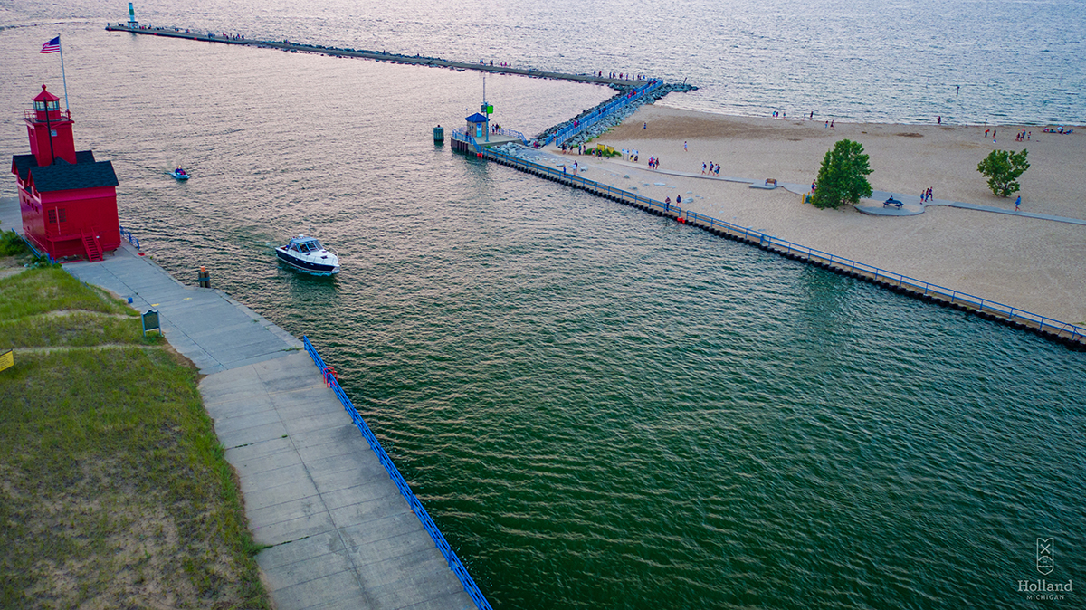 Lake Macatawa Channel with Big Red Lighthouse on the left and Holland State Park Beach on the right.