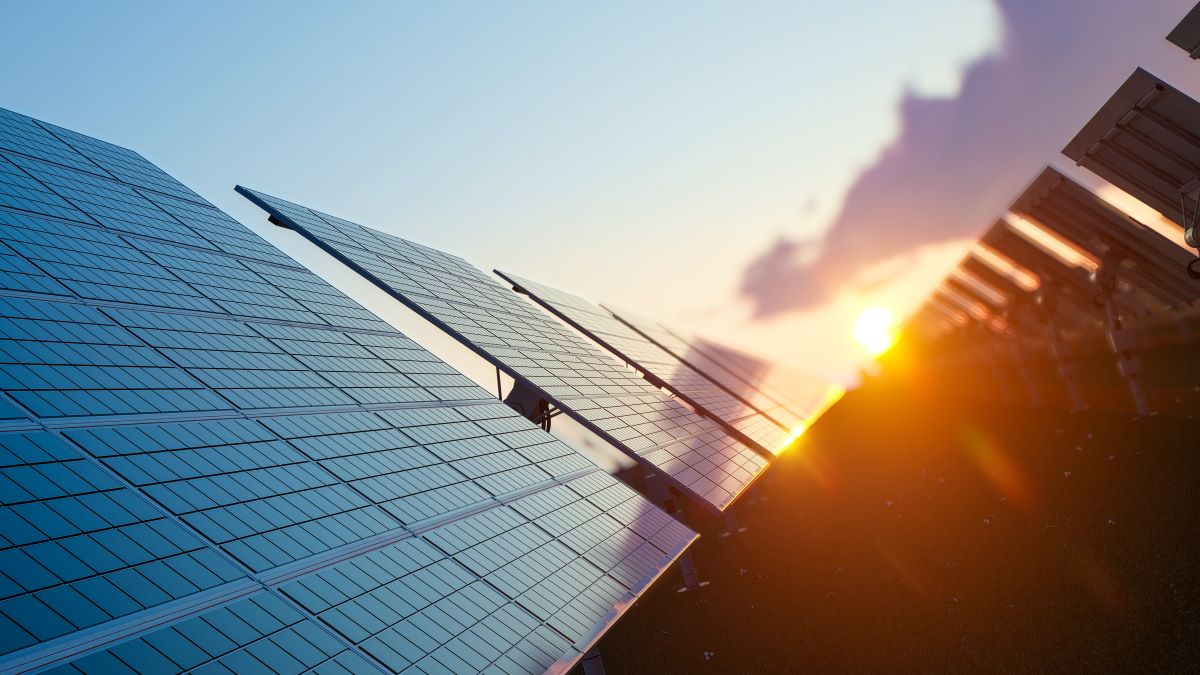 Artistic photo on an angle of a solar farm at sunset