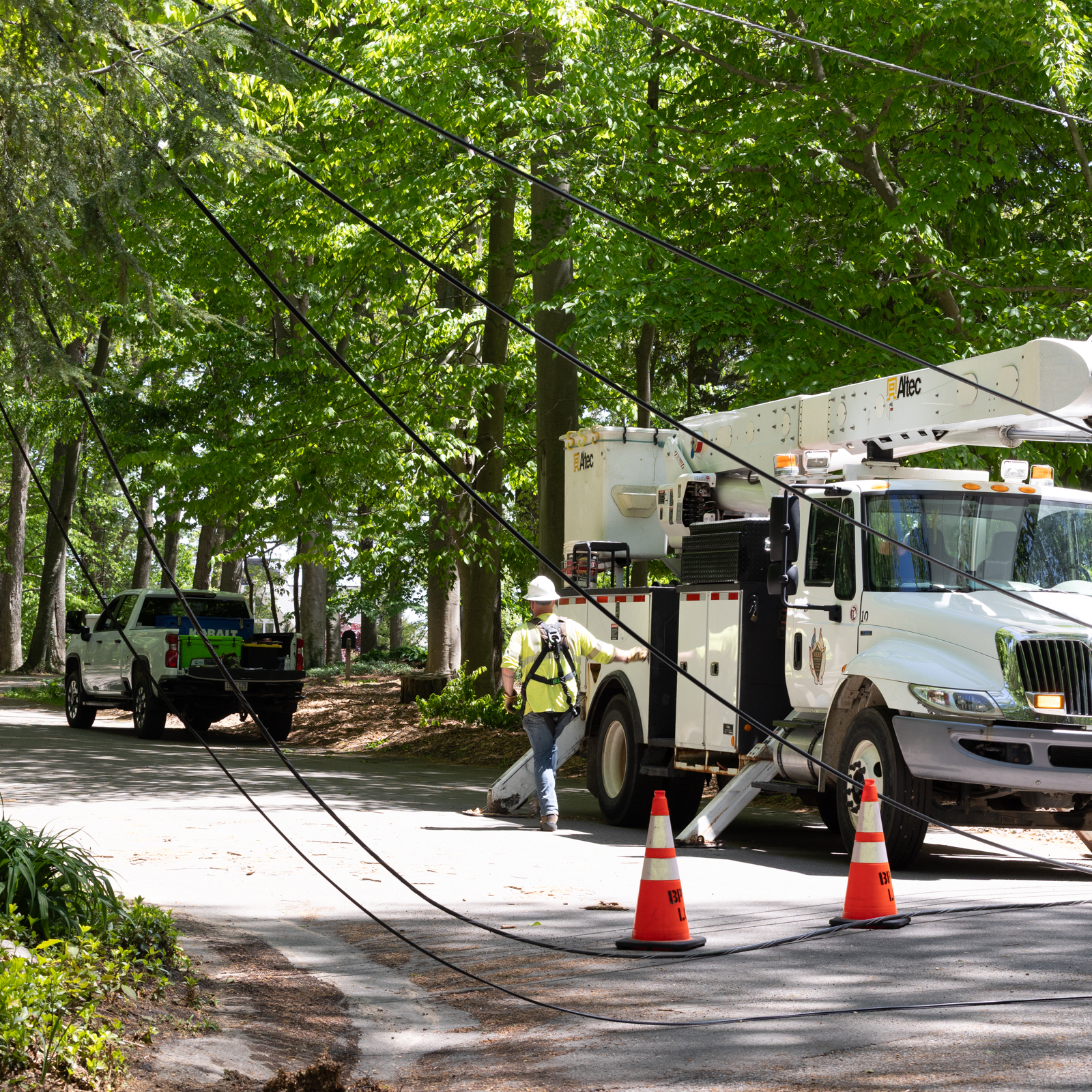 Niles bucket truck near downed power lines in Waukazoo woods