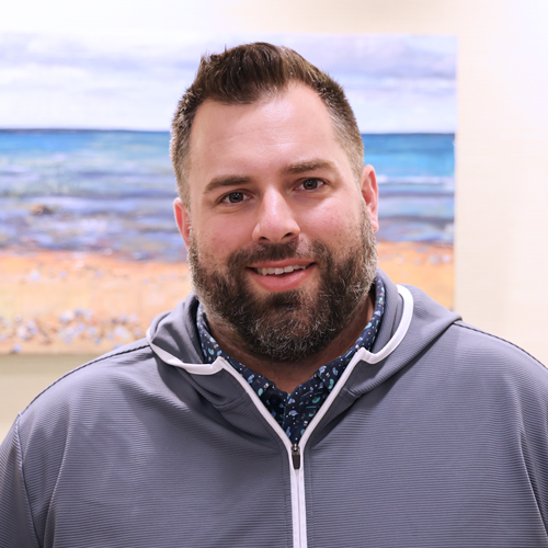 male executive wearing a grey jacket