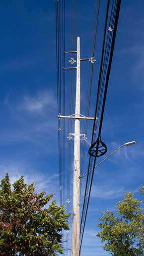 Utility pole againsta a blue sky